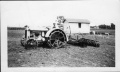 Caretaker Mr. Gill with Farmall tractor on July 24, 1927.