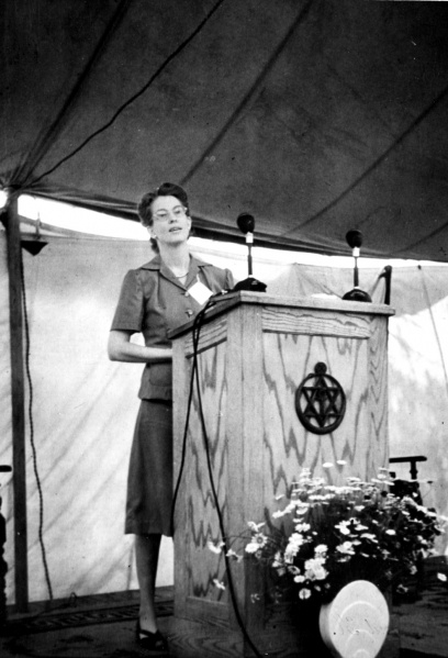 File:Joy Mills at podium ca1954.jpg